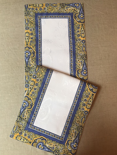pique quilted provencal table runner with blue border